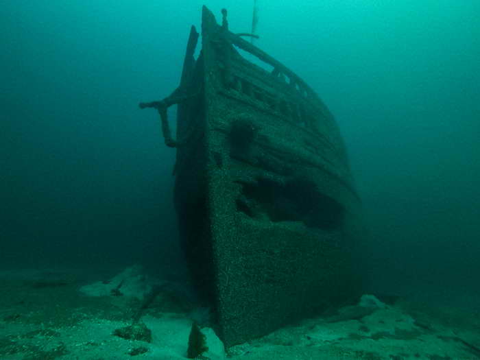 Shipwreck diving in the Great Lakes finds an old ship with holes in the bow